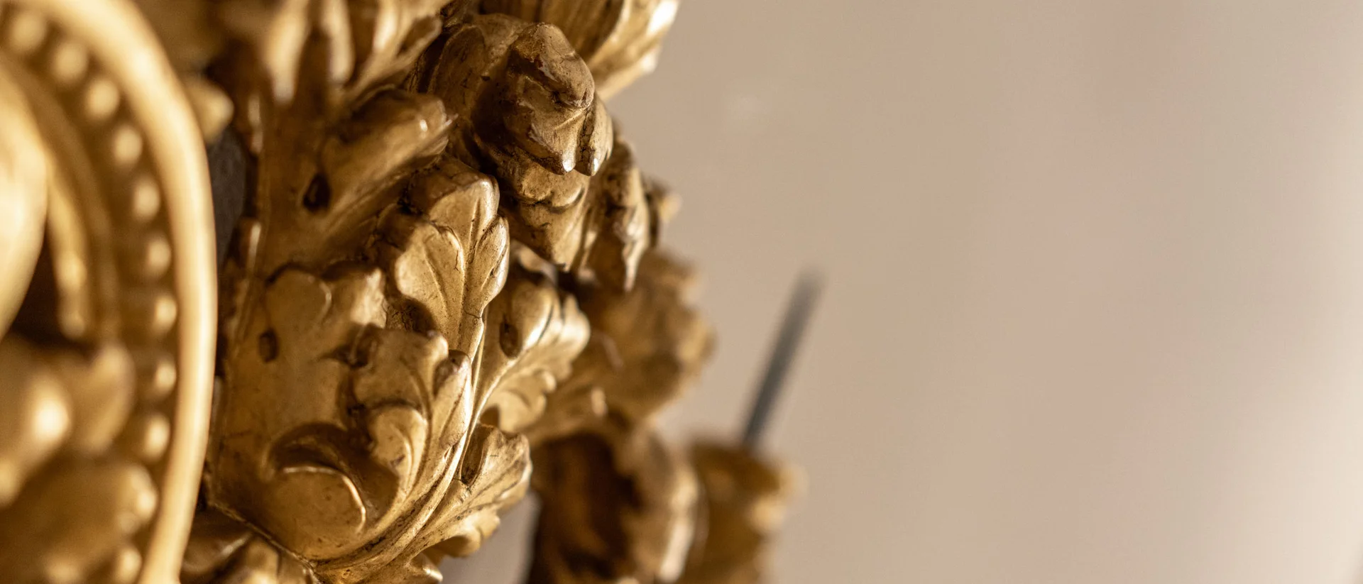 Close-up of ornate gold wall decoration with intricate patterns